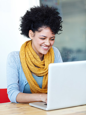 Buy stock photo An attractive young woman sitting at her laptop