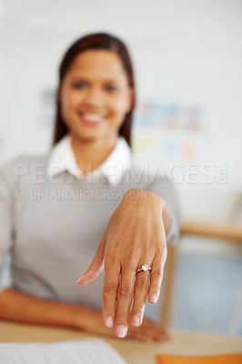 Buy stock photo Hand, woman and ring for wedding engagement, commitment and happiness in office. Wedding ring, diamonds and happy woman hands, smile and jewelry for love, marriage or save the date at work desk
