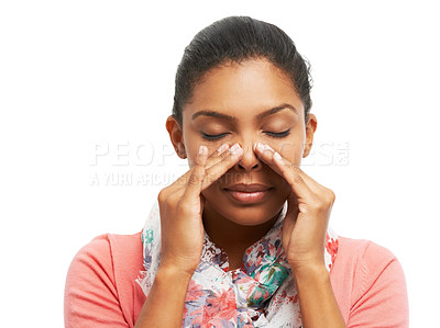 Buy stock photo A pretty young woman battling sinus problems while isolated on a white background