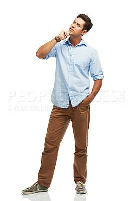 Buy stock photo A thoughtful young man looking upwards while isolated on a white background