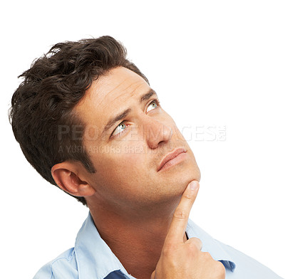 Buy stock photo A young man looking upwards thoughtfully while isolated on white
