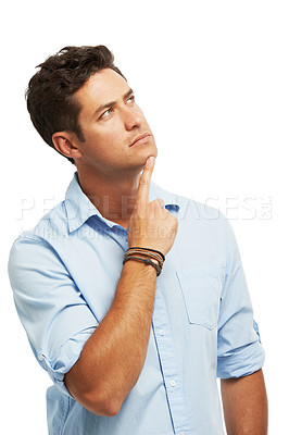 Buy stock photo A young man looking upwards thoughtfully while isolated on white