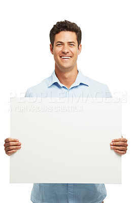 Buy stock photo Happy, poster and portrait of man in studio for news, announcement and information. Mockup space, promotion and isolated person with sign, banner and billboard for advertising on white background