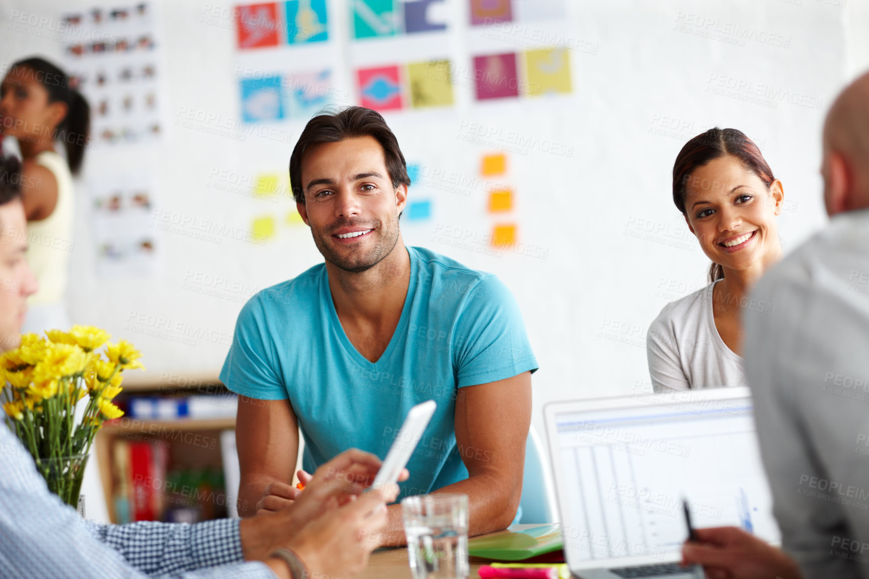 Buy stock photo Man, portrait and smile in meeting at startup with group, pride and tech at graphic design agency. Person, happy and collaboration in office, diversity and computer for project, review and feedback