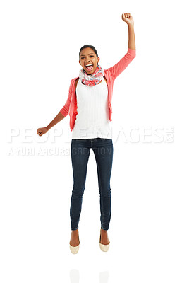 Buy stock photo A full body portrait of a pretty young woman jumping with arms raised against a white background