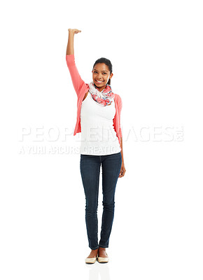 Buy stock photo A full body portrait of a pretty young woman posing with one arm raised against a white background