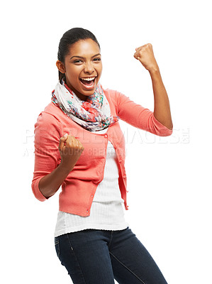 Buy stock photo Portrait of a smiling young woman air punching against a white background