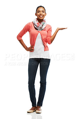 Buy stock photo Full body portrait of a pretty young woman displaying your product against a white background