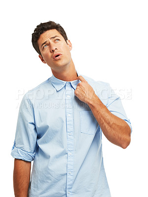 Buy stock photo A handsome young man tugging at his color against a white background