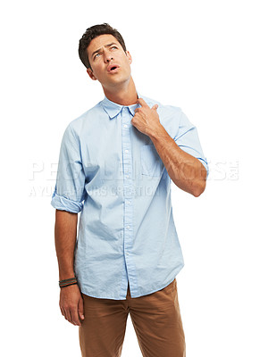 Buy stock photo A handsome young man tugging at his color against a white background