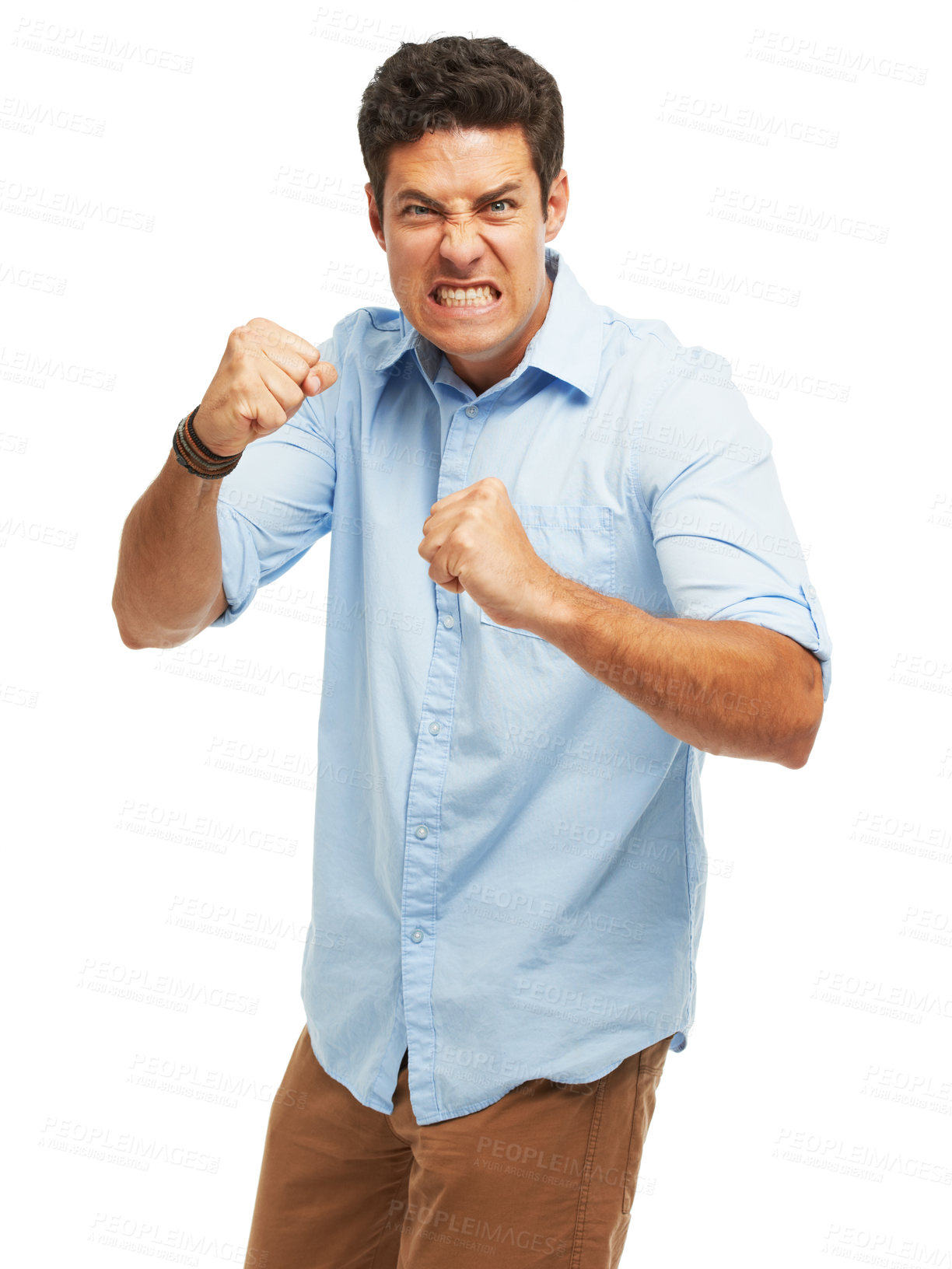 Buy stock photo Portrait, man and angry with raised fist for fighting, conflict and aggressive on white background for emotion. Male person, punch and unhappy in studio with frustrated as upset, annoyed and furious