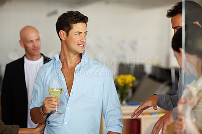 Buy stock photo Businessman, smile and wine at party in office for company event, beverage and gathering at work. Employees, colleagues and conversation with alcohol for celebration, drinks and end of year function