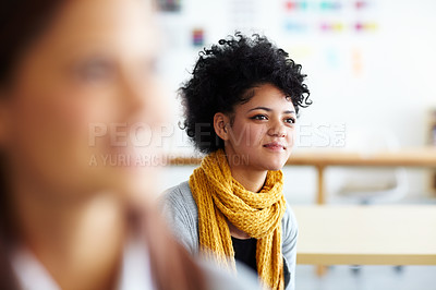 Buy stock photo A beautiful young woman sitting and listening to a presentation