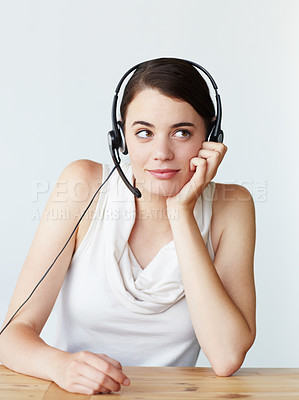 Buy stock photo Headset, customer service and bored woman in office with telemarketing, call center or crm. Tired, contact us and young female technical support agent with outbound consultation at help desk.