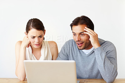 Buy stock photo Couple, shocked and laptop on table in home for poll website, information and reading online news. Man, woman and surprise with tech for voting update, announcement or results of elections in America