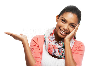 Buy stock photo A beautiful young woman leaning er head on her hand while holding an imaginary object with the other