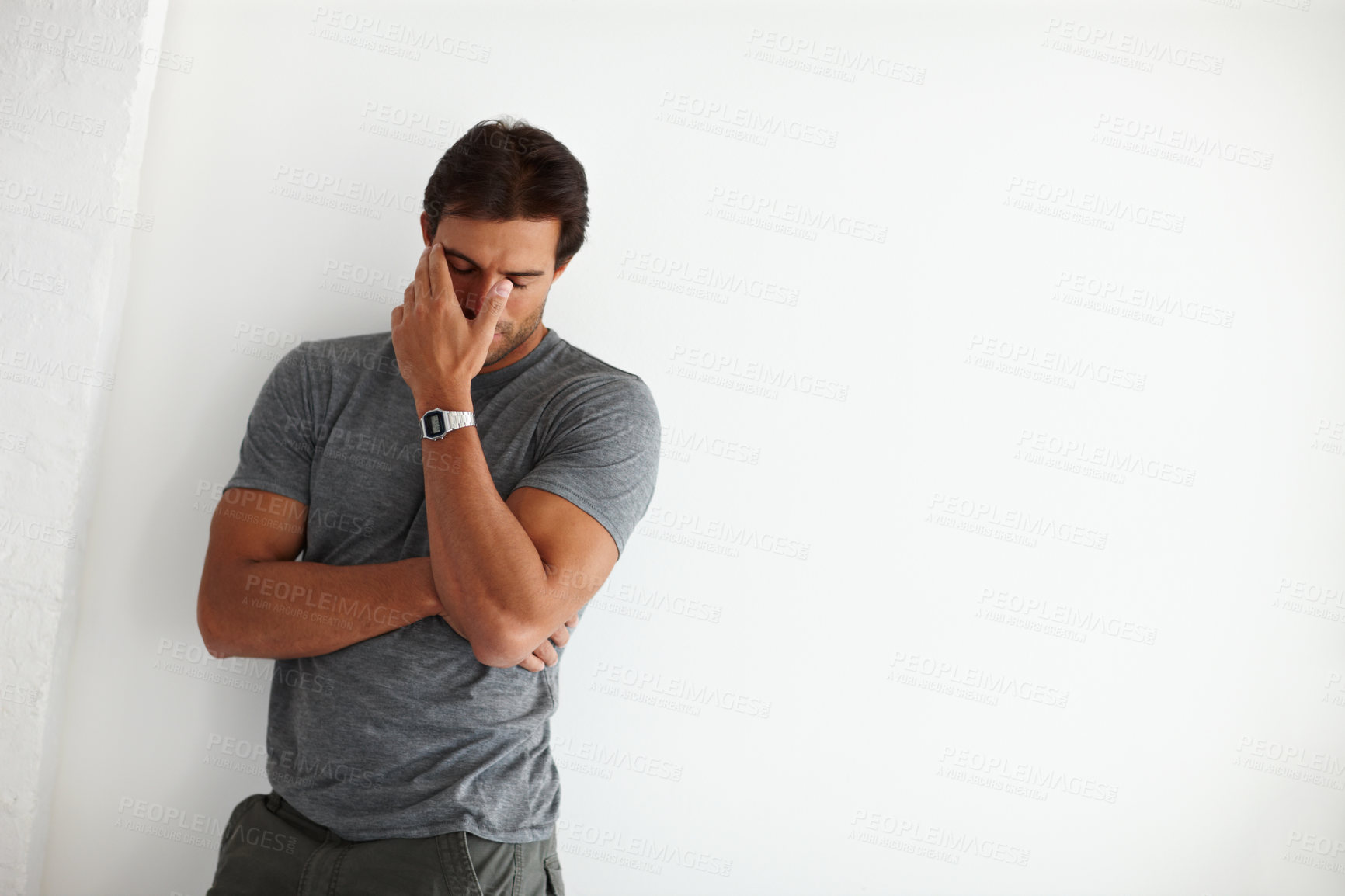 Buy stock photo Upset, mental health and man by wall with stress for infidelity, cheating and divorce by mockup space. Angry, mistake and male person with regret for breakup with anxiety for failure in home.