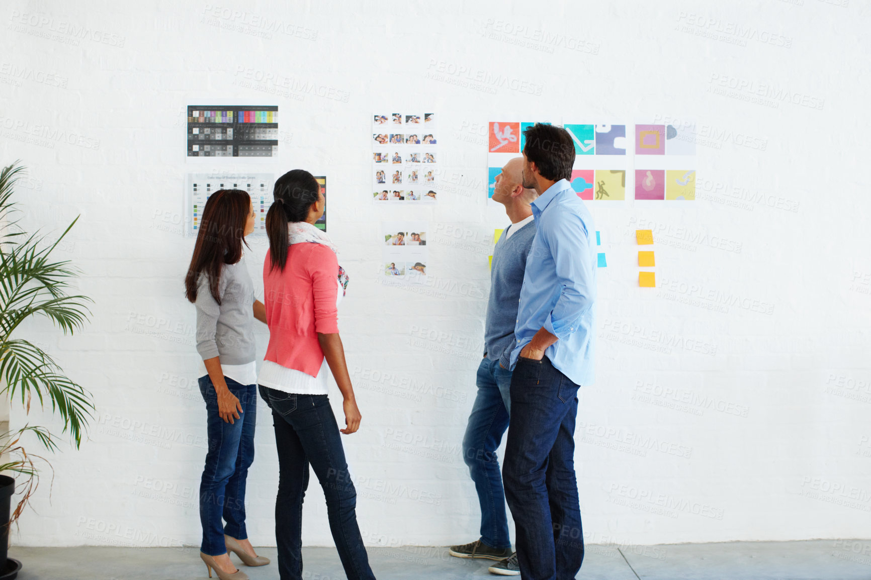 Buy stock photo Wall, design and team planning moodboard, brand or creative marketing in office and brainstorm logo. Board, business people and meeting for designers discuss homepage layout, goal and vision together