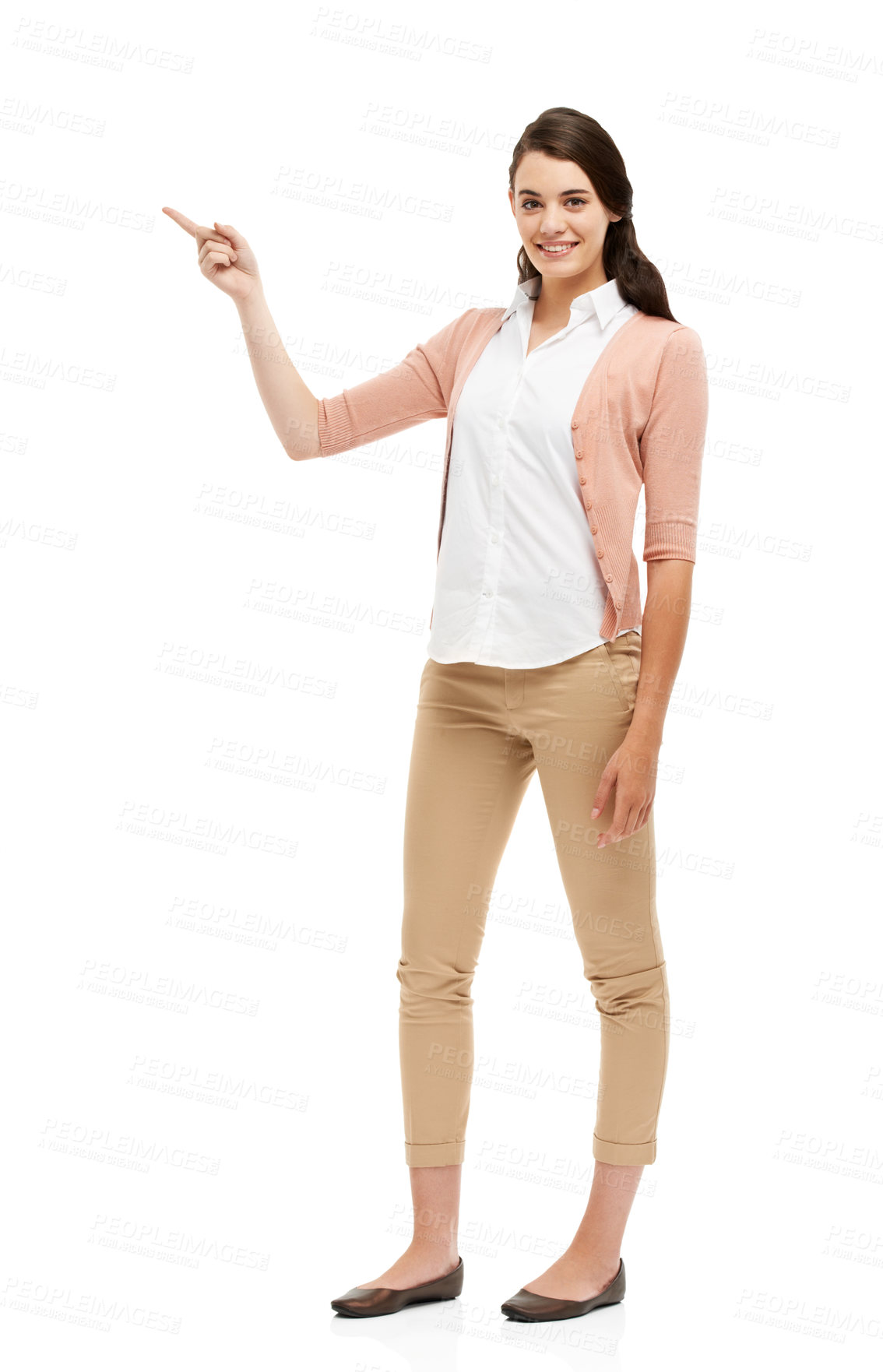 Buy stock photo Full length portrait of an attractive young woman pointing towards your copyspace