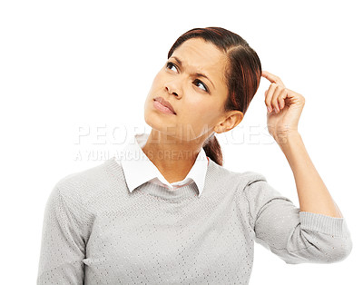 Buy stock photo Studio shot of a young woman scratching her head while thinking isolated on white