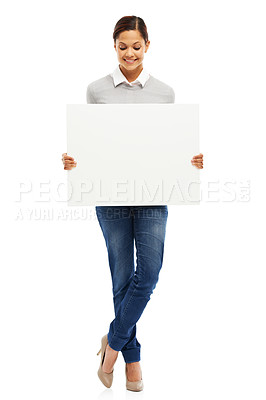 Buy stock photo Studio portrait of an attractive young woman holding a blank placard isolated on white