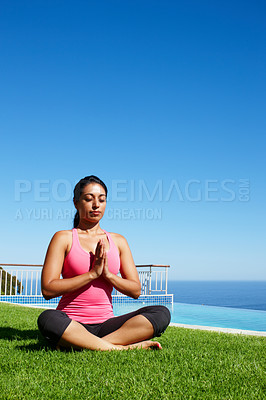 Buy stock photo Meditation, yoga and woman on grass by water for holistic fitness, mindfulness and breathing exercise. Faith, hands in prayer and person by ocean for wellness, health and zen energy outdoors