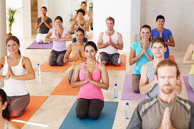 Buy stock photo A group of people in yoga class sitting with hands together