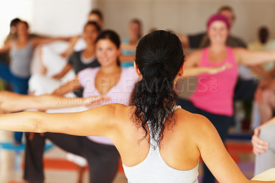 Buy stock photo Back, stretching and yoga class with an instructor in a studio for health, wellness or holistic training. Fitness, exercise and a yogi teaching a student group about zen, balance or inner peace