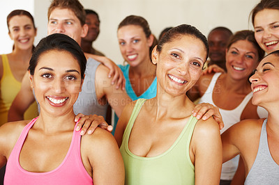 Buy stock photo Portrait of a a group of yoga enthusiasts standing in a yoga studio