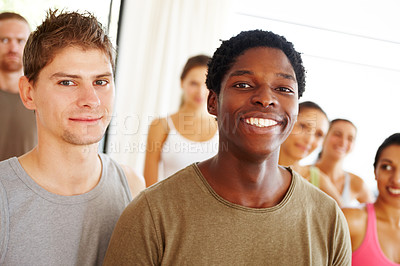 Buy stock photo Portrait, wellness or fitness and black man with a group of people in a studio for health or mindfulness. Exercise, training or mindfulness with happy young friends in gym class for holistic training