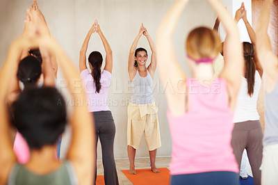 Buy stock photo Stretching, yoga and group with personal trainer in class for fitness, exercise and workout on mat. Pilates, club and happy instructor with men and women for wellness, balance and healthy body