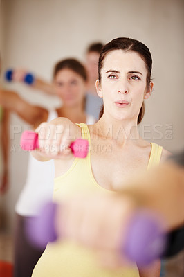 Buy stock photo Pilates, class and women with dumbbell for fitness, wellness and healthy body care in gym. Power, balance and group of people at exercise club together for weights, muscle strength and yoga workout