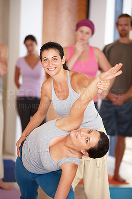 Buy stock photo Yoga, class and teacher help with portrait and stretching for health, wellness and flexibility in studio. Relax, students and instructor with seminar and workshop for balance on gym mat with people