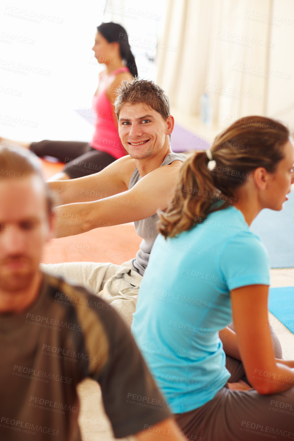 Buy stock photo Yoga, class and man with smile for stretching with health, wellness and flexibility in pilates studio. Relax, student and happy at seminar and workshop for calm and balance learning on gym mat