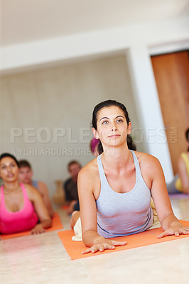 Buy stock photo A pretty mature woman lying on her stomach and looking away - Yoga 