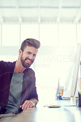 Buy stock photo Portrait of a young designer sitting at his computer in an office