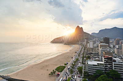 Buy stock photo Drone, beach and city with sunshine, nature and travel with Rio de Janeiro, Brazil and vacation. Getaway trip, aerial view and outdoor with mountains, seaside and sand with buildings and vacation