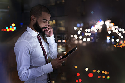 Buy stock photo Shot of a businessman talking on his cellphone late at night. Real life businesspeople shot on location. Since these locations are the real thing, and not shot in an 