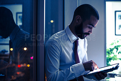 Buy stock photo Working, male professional and tablet in office at night for strategy, research and planning corporate growth. Businessman, reading and emailing on digital device for job, company or connectivity 