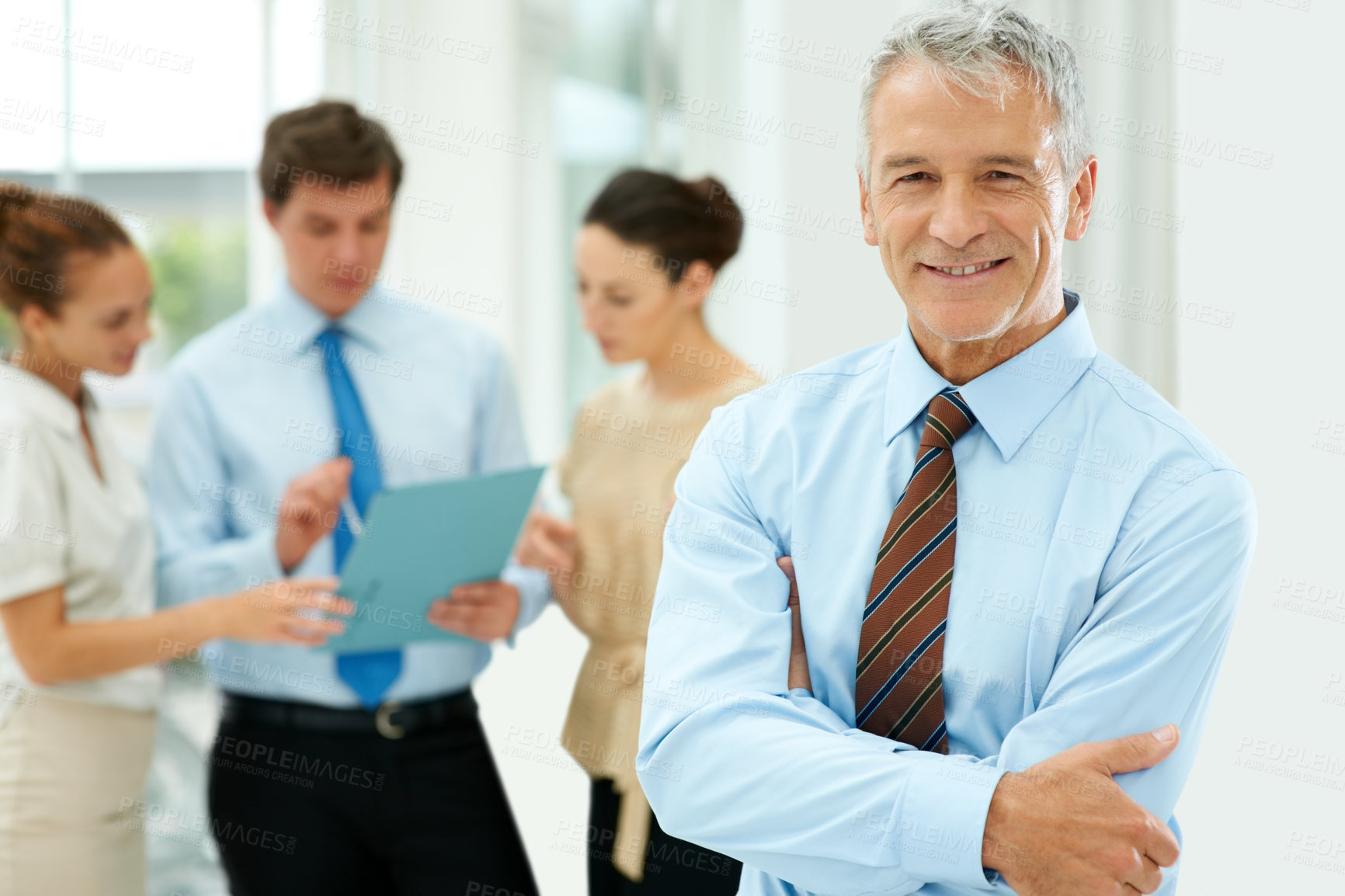 Buy stock photo Smile, portrait and senior businessman with team of people in the office with positive, good and confident attitude. Happy, career and manager with a group of professional employees in workplace