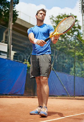 Buy stock photo Man, confident and serve in outdoor tennis match, game and court for competition or practice. Male person, athlete and ready for training or exercise, workout and hobby for action and play fitness