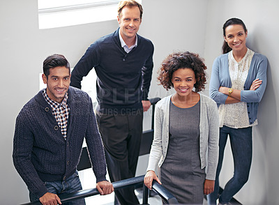 Buy stock photo Portrait of a group of office coworkers standing in a stairwell