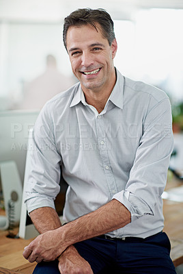 Buy stock photo Portrait of a mature businessman sitting on his desk