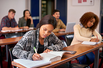 Buy stock photo Shot of students working diligently in class