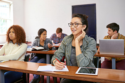 Buy stock photo Classroom, student and thinking with smile in university for answer, information and education. College, girl and students on campus for studying, writing and learning with books or tech for quiz