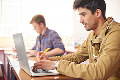 Buy stock photo College student, man and laptop with typing in classroom for studying, research or assessment for development. Person, education and learning on computer to search for academic article at university