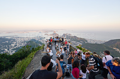 Buy stock photo Shot of tourists taking pictures from a lookout point over Rio