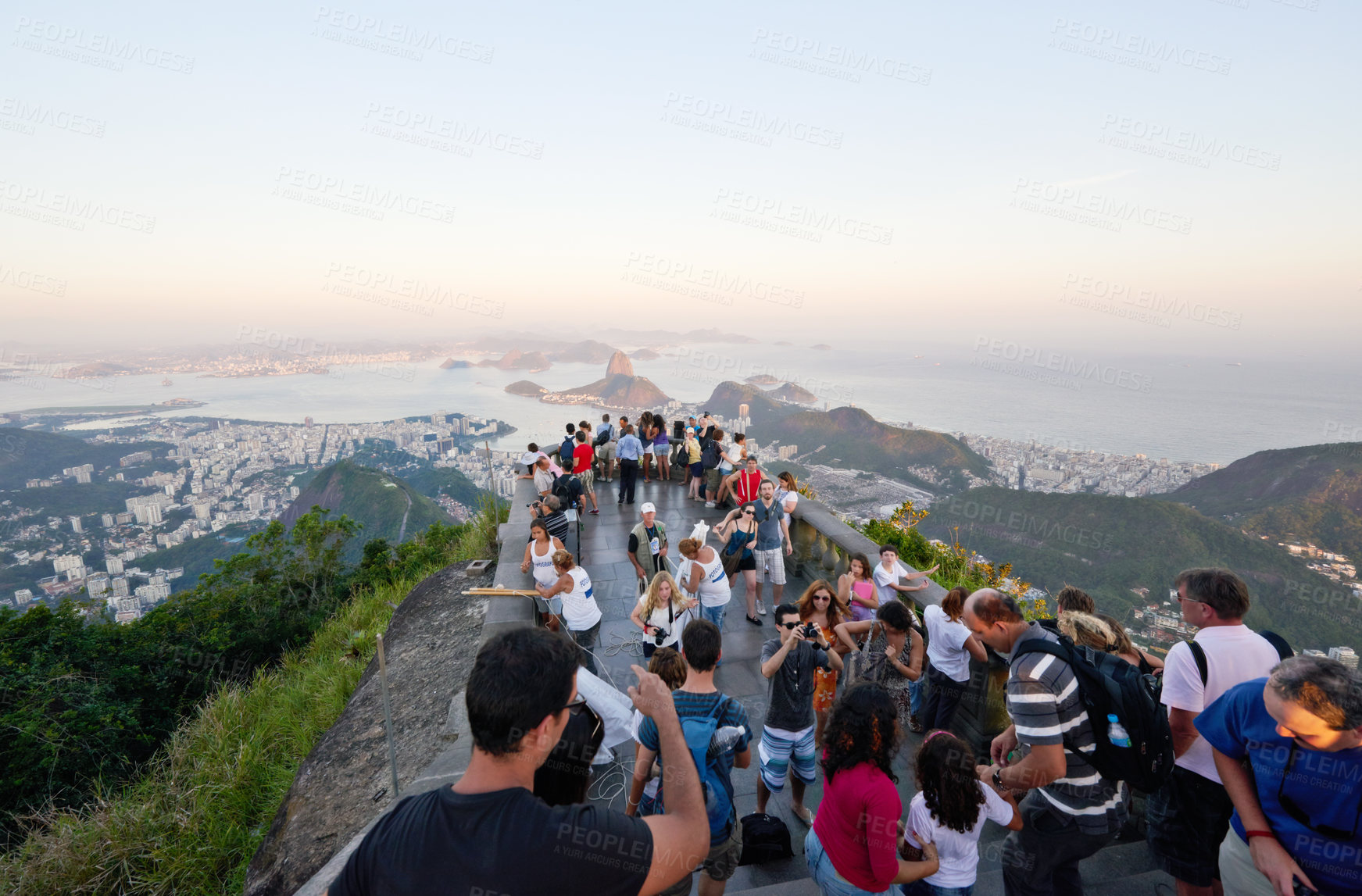 Buy stock photo Shot of tourists taking pictures from a lookout point over Rio