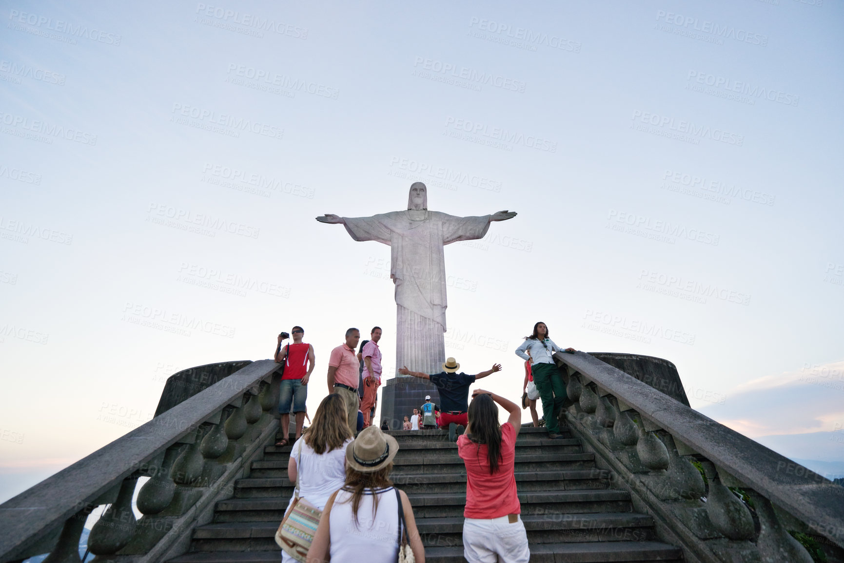 Buy stock photo People, christ and steps with statue for tourism in rio de Janeiro of redeemer, sightseeing or landmark sculpture. Group, community or crowd on tour, trip or monument of iconic attraction in Brazil