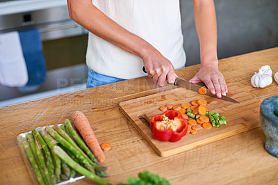 Buy stock photo Cooking, kitchen counter and hands of woman with healthy food, meal prep and cutting fresh vegetables for lunch. Diet, wellness and girl in home with ingredients, nutrition and dinner in apartment.